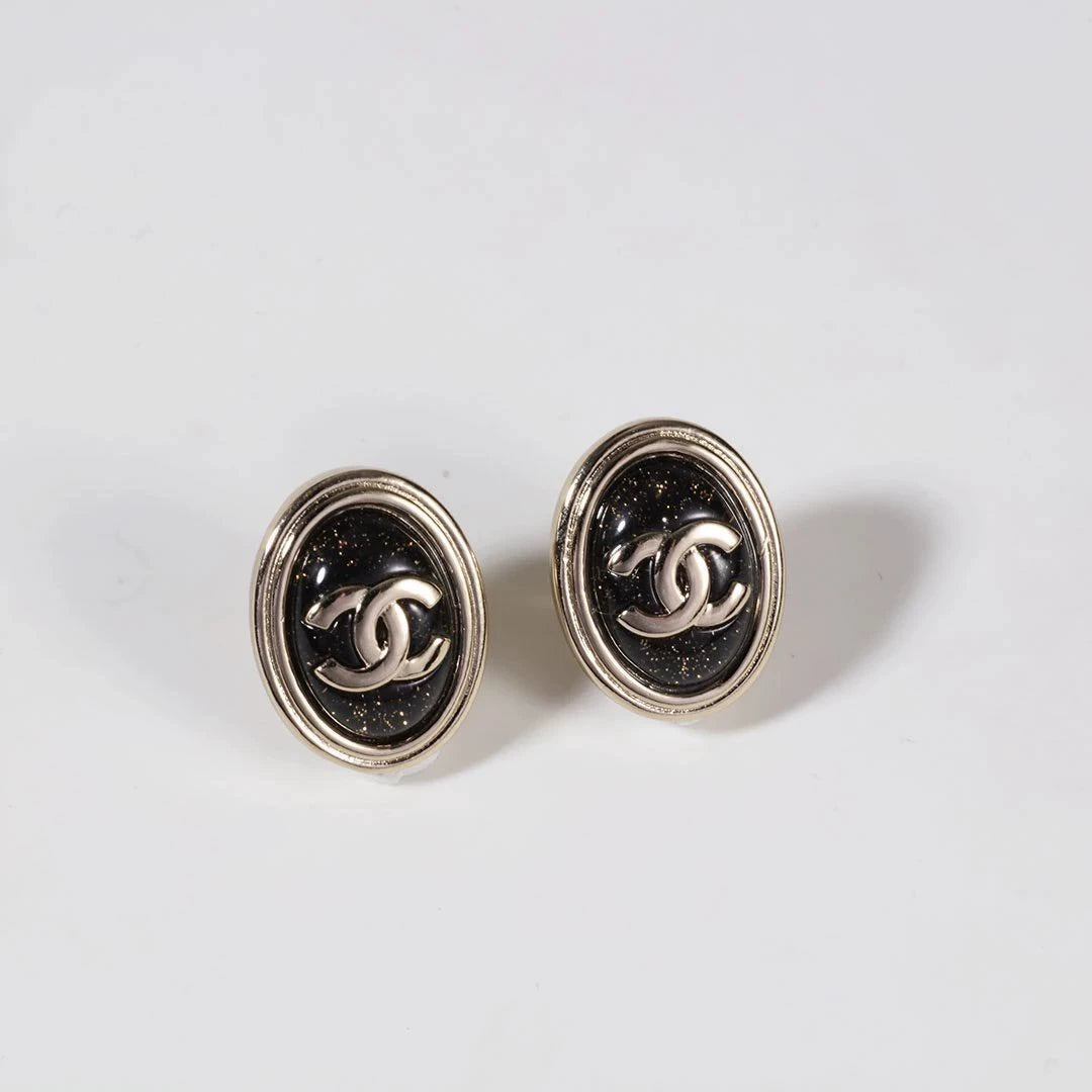 C 25 Gold Oval Black Double C Stud Earrings