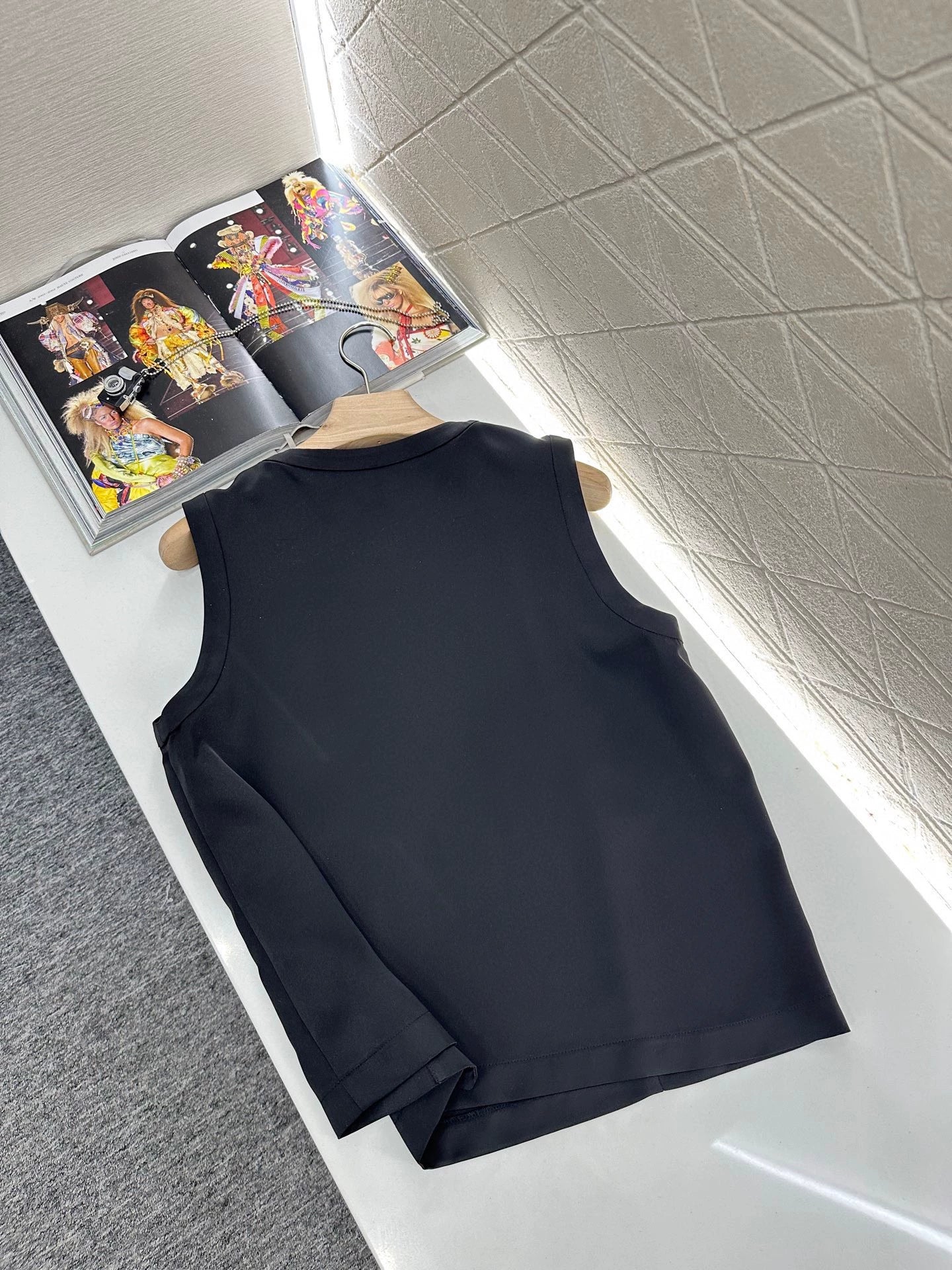 Sleeveless button-down top