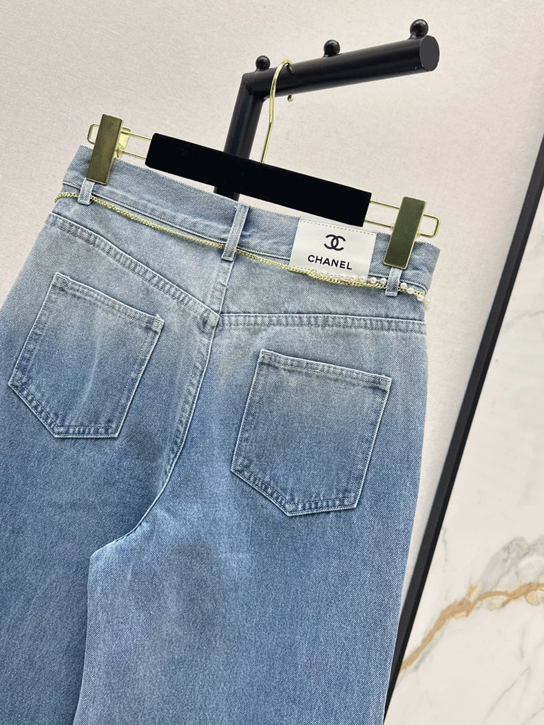 C 25 New early fall wide-leg jeans with a metal waist chain.