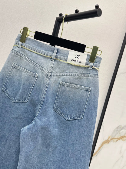C 25 New early fall wide-leg jeans with a metal waist chain.