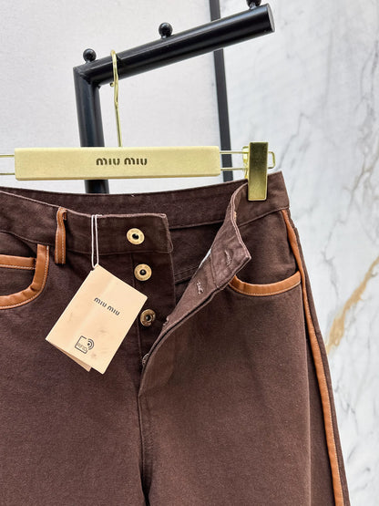 M 25 Brown jeans with leather detailing