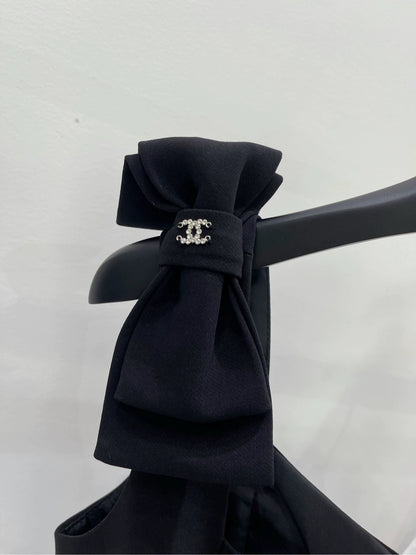C 25 Shoulder bow black skirt
