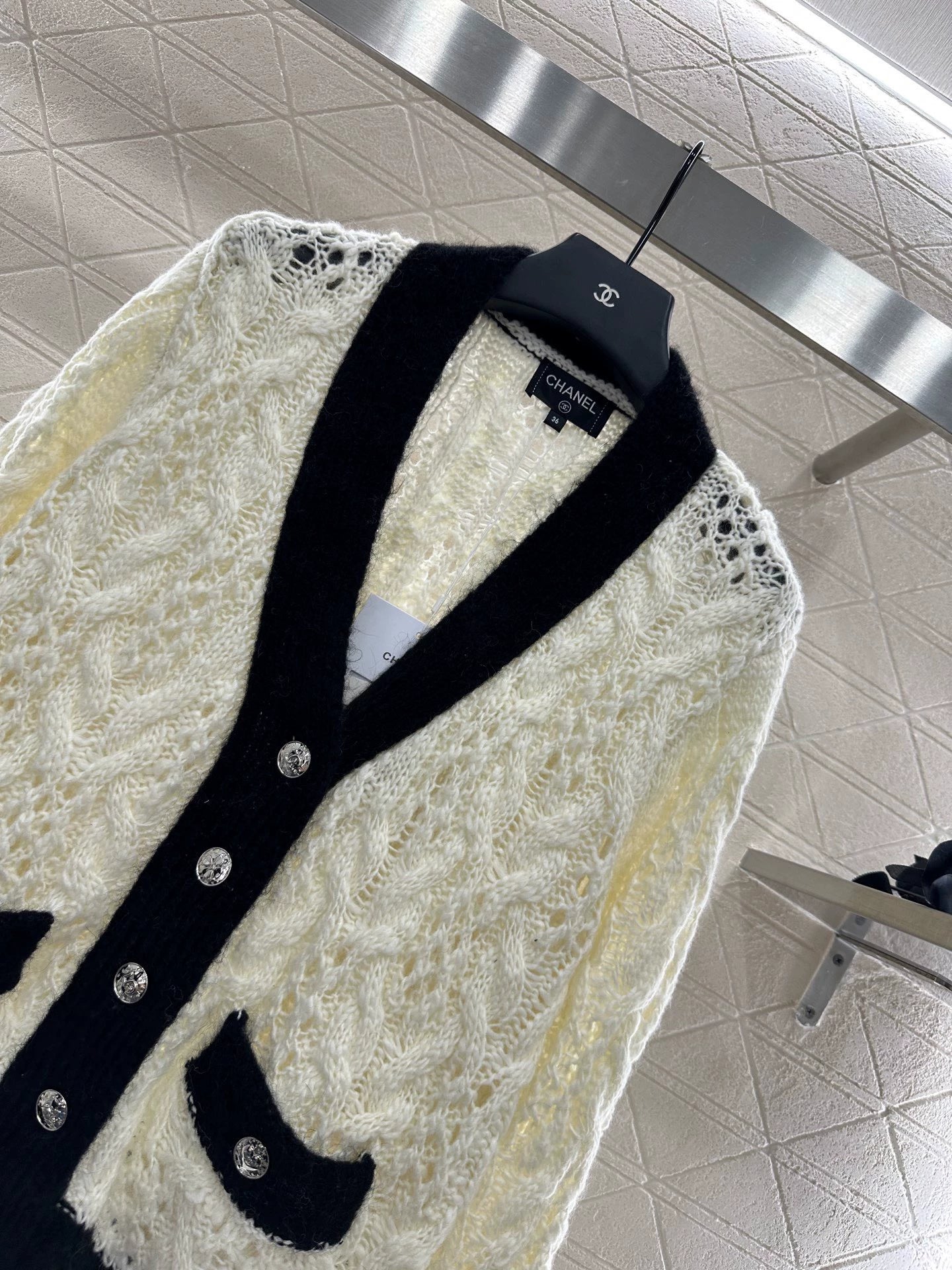 C 25 Contrast-color crochet cardigan.
