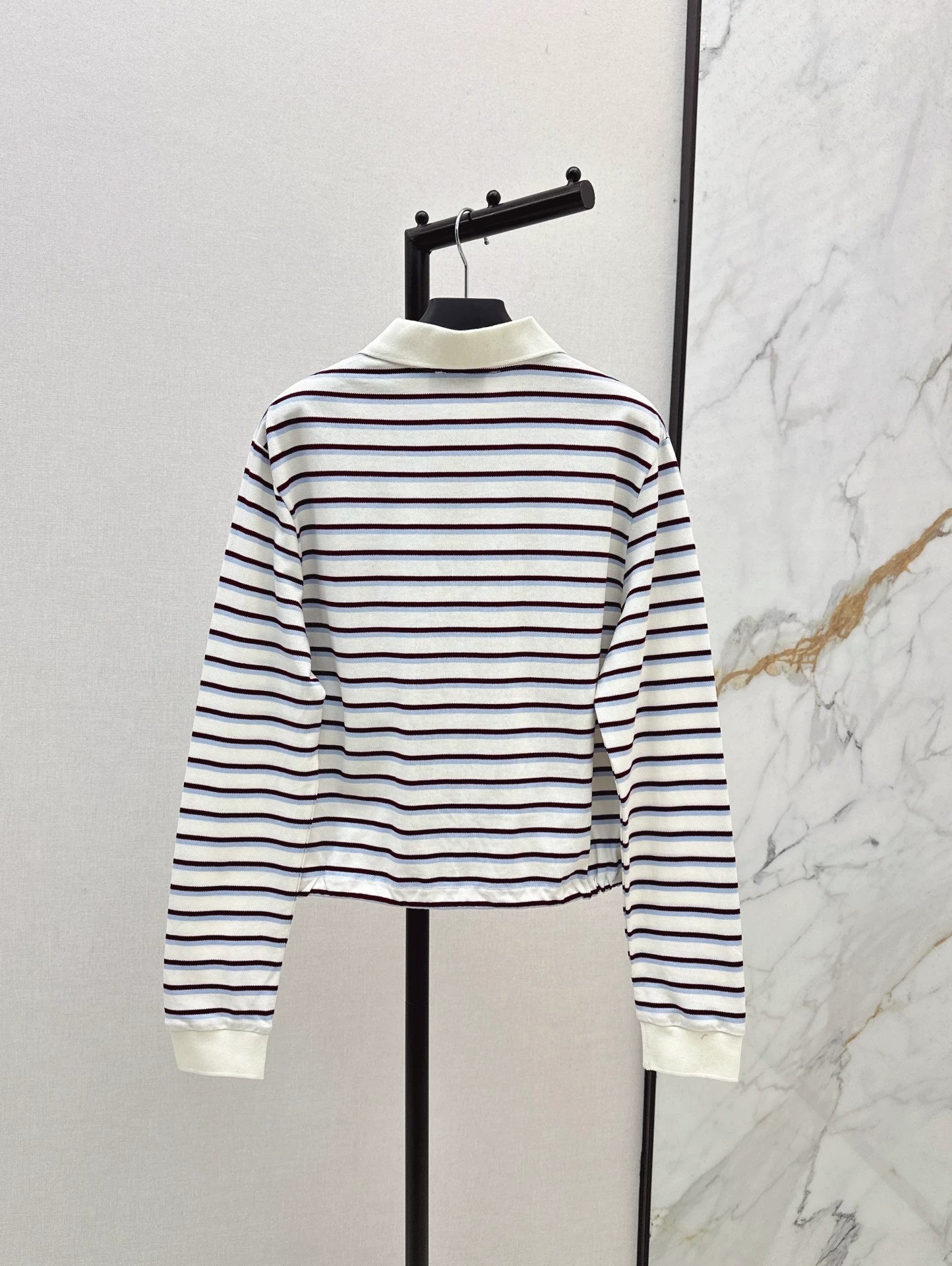 P 25 New Striped long-sleeve polo shirt