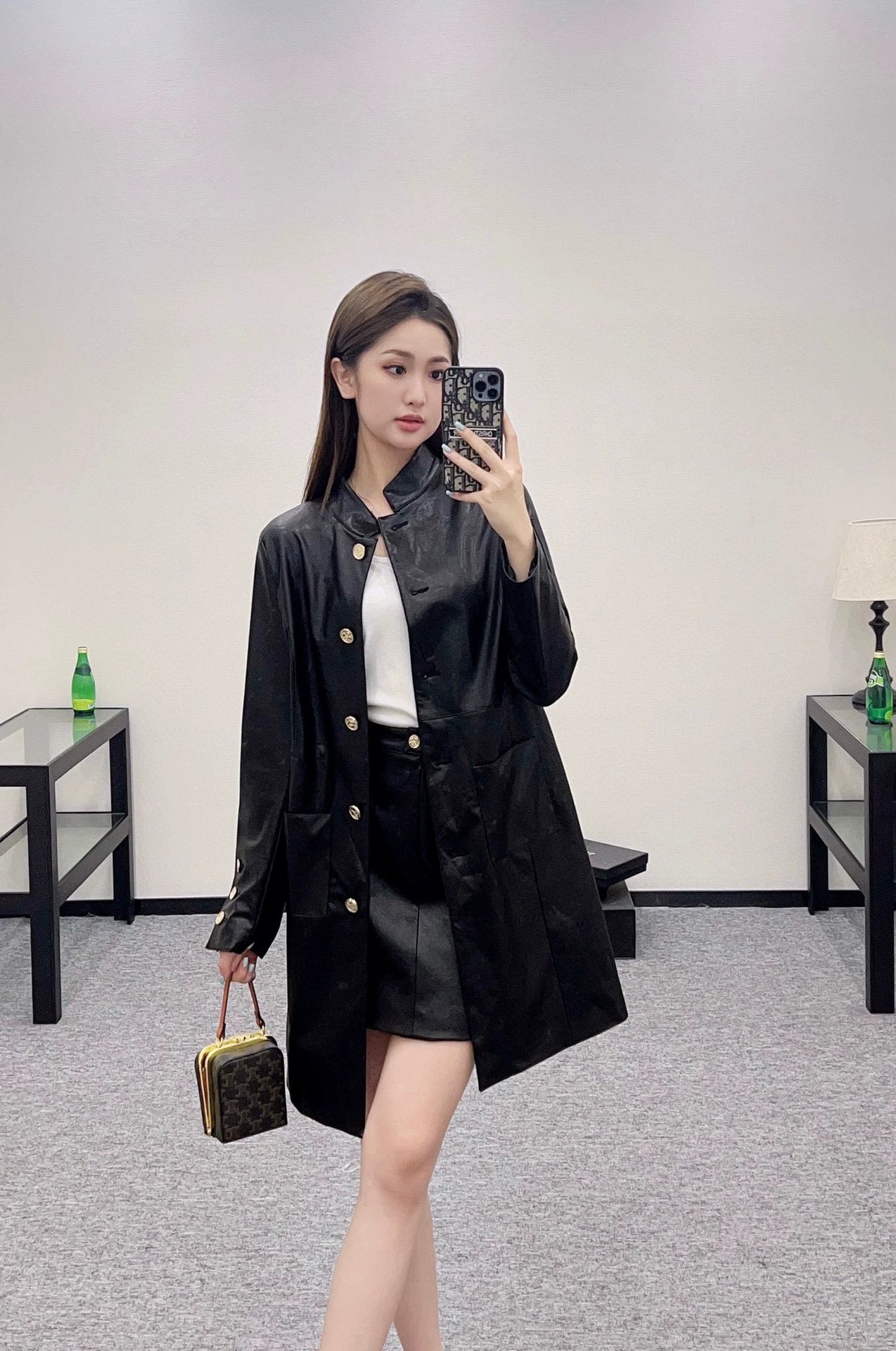 C 25 Mid-length leather trench coat.