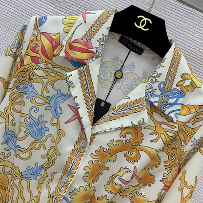 Ve New 25-inch starfish and conch shell print two-piece suit with a stylish holiday vibe.