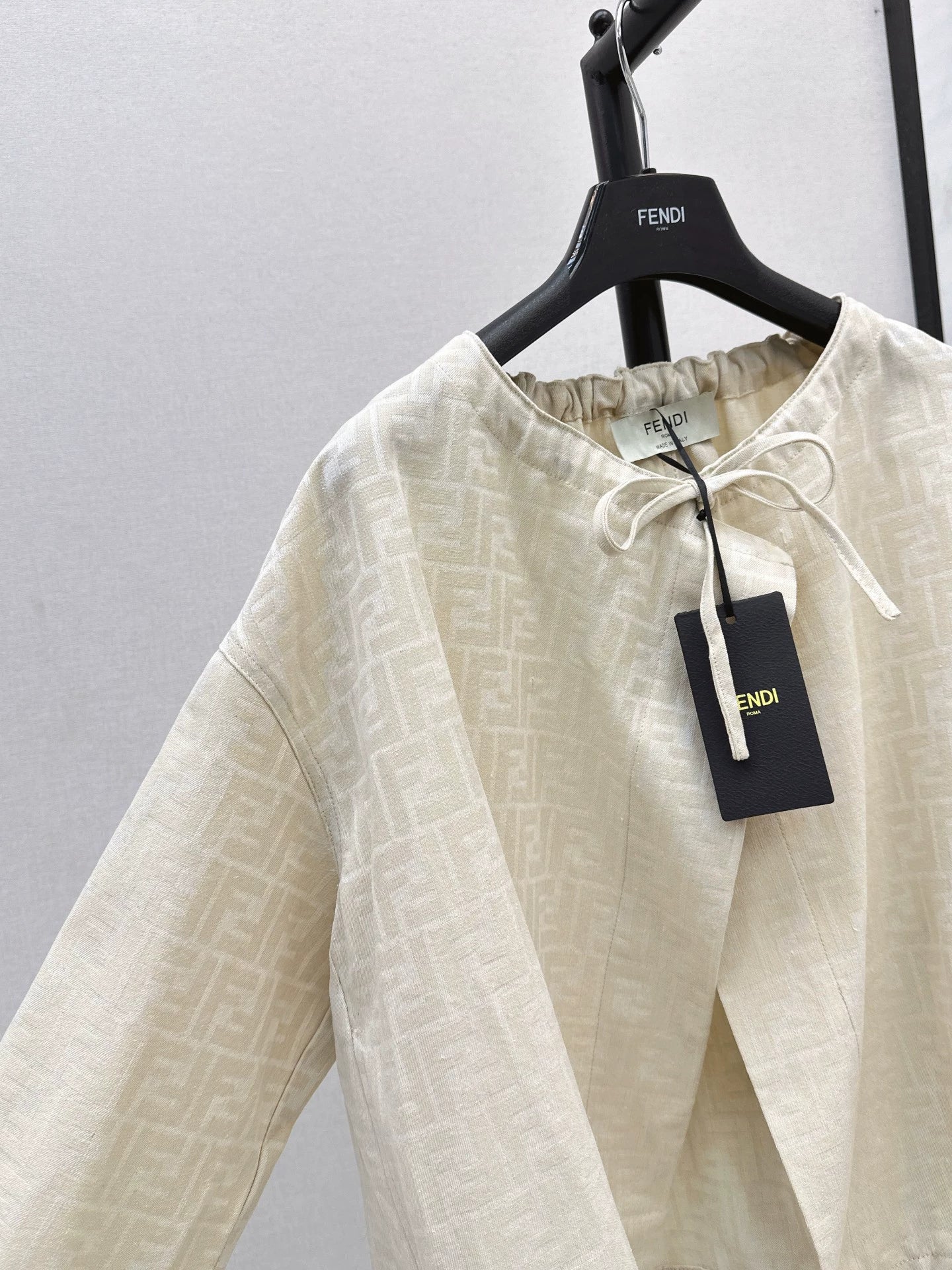 Fe 25 letter print cape coat