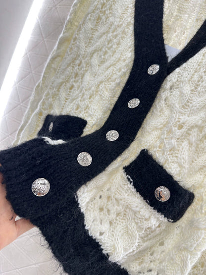 C 25 Contrast-color crochet cardigan.