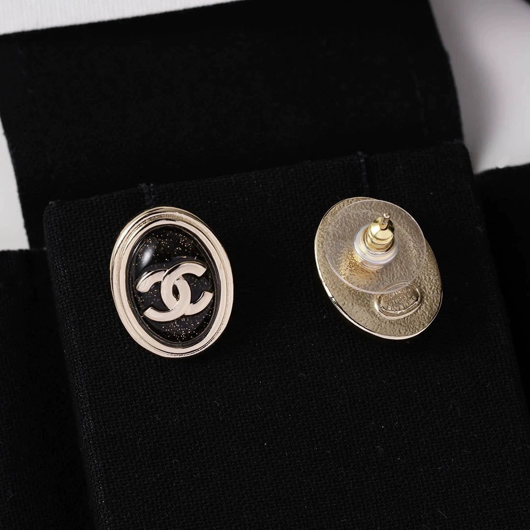 C 25 Gold Oval Black Double C Stud Earrings