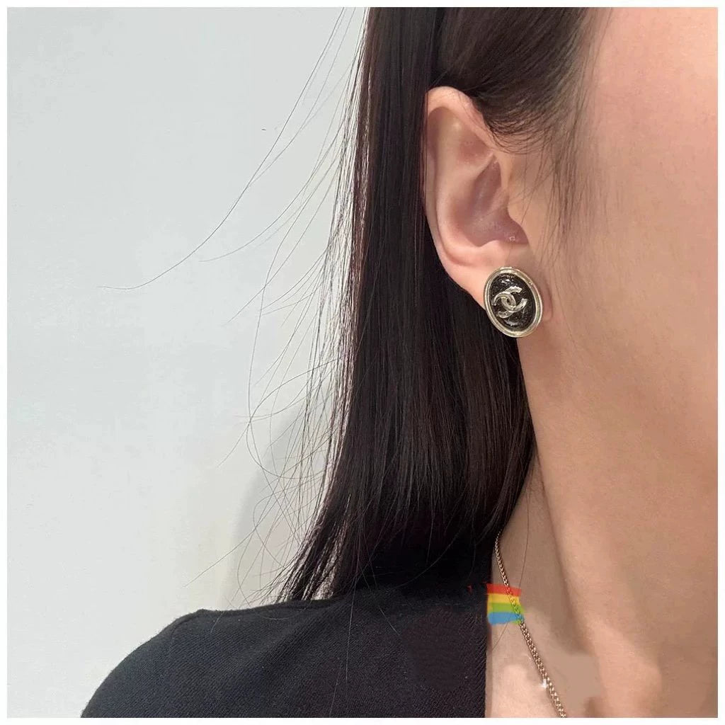 C 25 Gold Oval Black Double C Stud Earrings