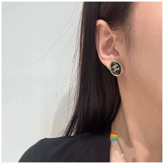 C 25 Gold Oval Black Double C Stud Earrings