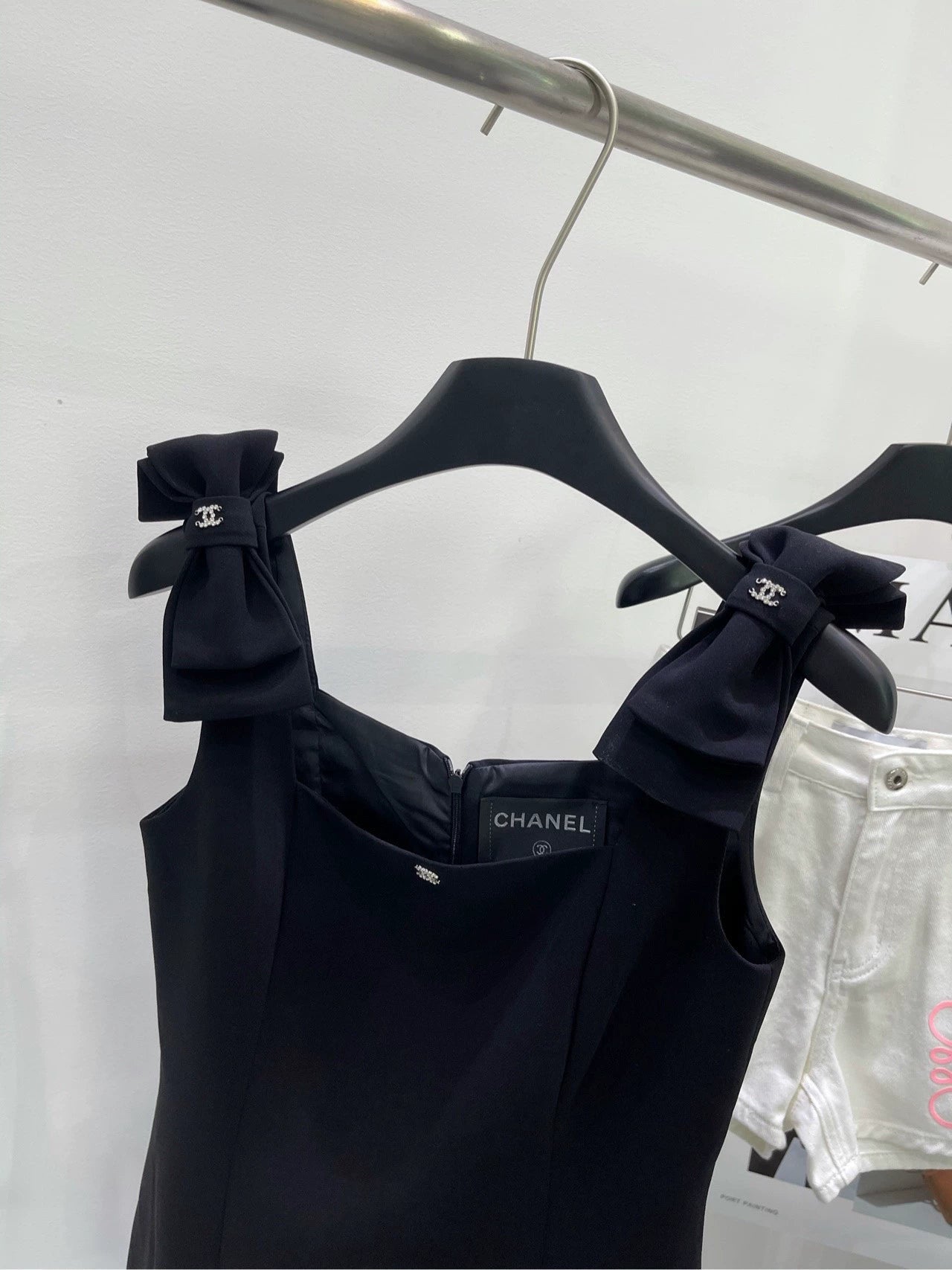 C 25 Shoulder bow black skirt