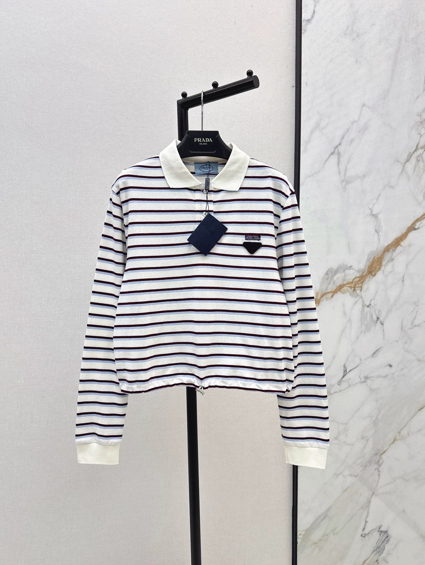 P 25 New Striped long-sleeve polo shirt