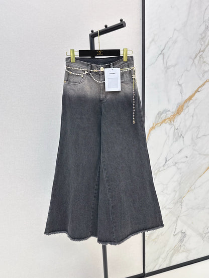 C 25 New early fall wide-leg jeans with a metal waist chain.