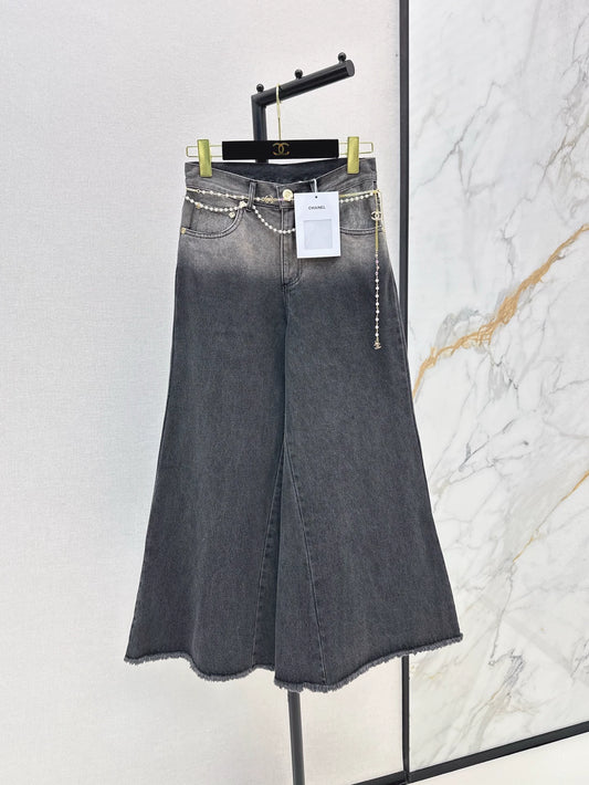 C 25 New early fall wide-leg jeans with a metal waist chain.