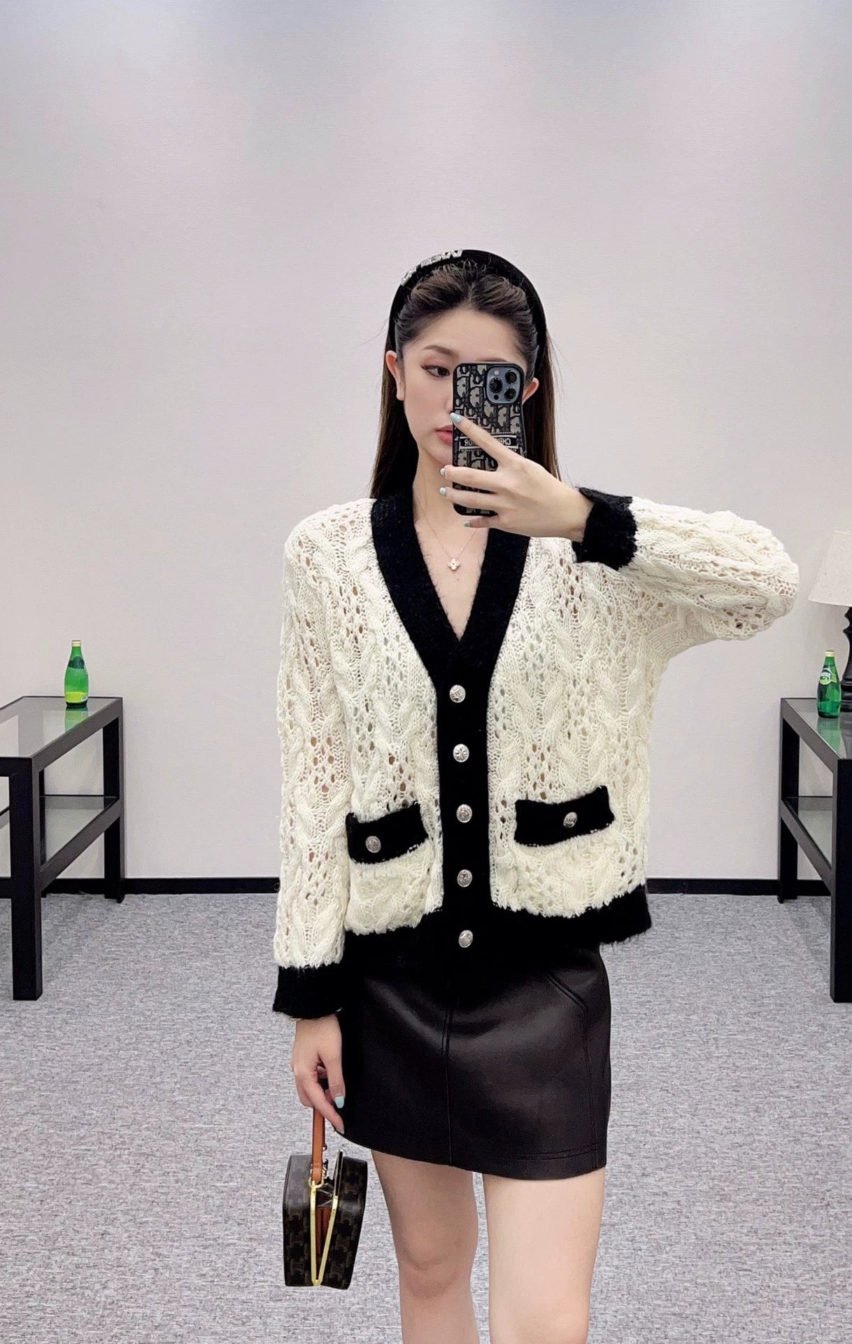 C 25 Contrast-color crochet cardigan.
