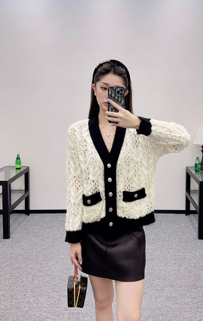 C 25 Contrast-color crochet cardigan.