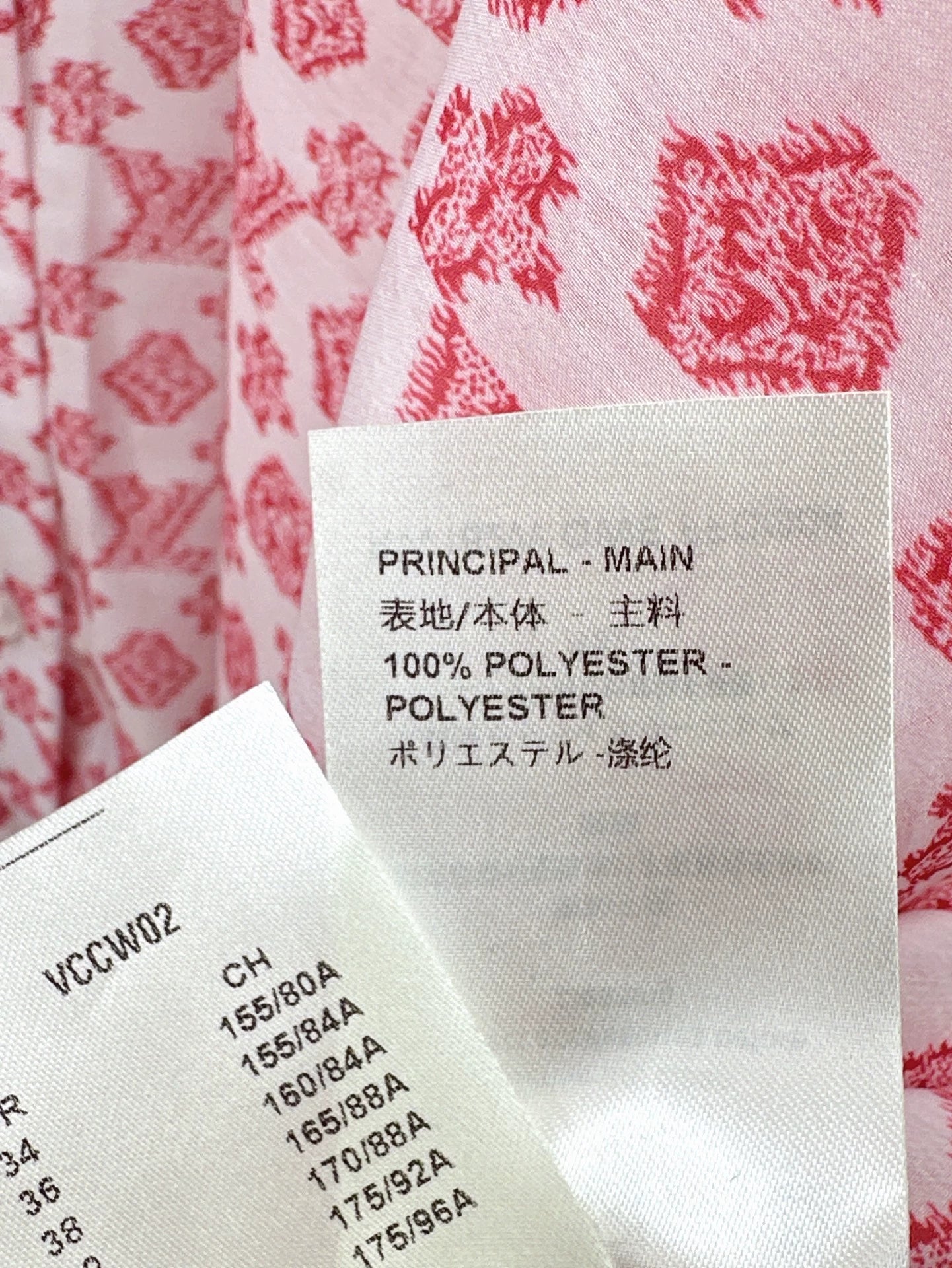 L 25 New irregular cape style shirt