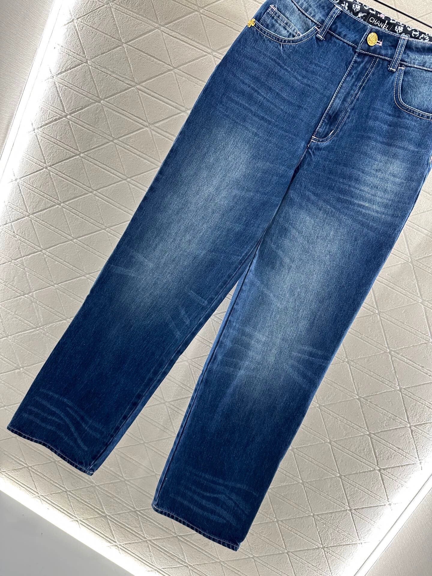 C 25 High-waisted bleached pleated denim trousers