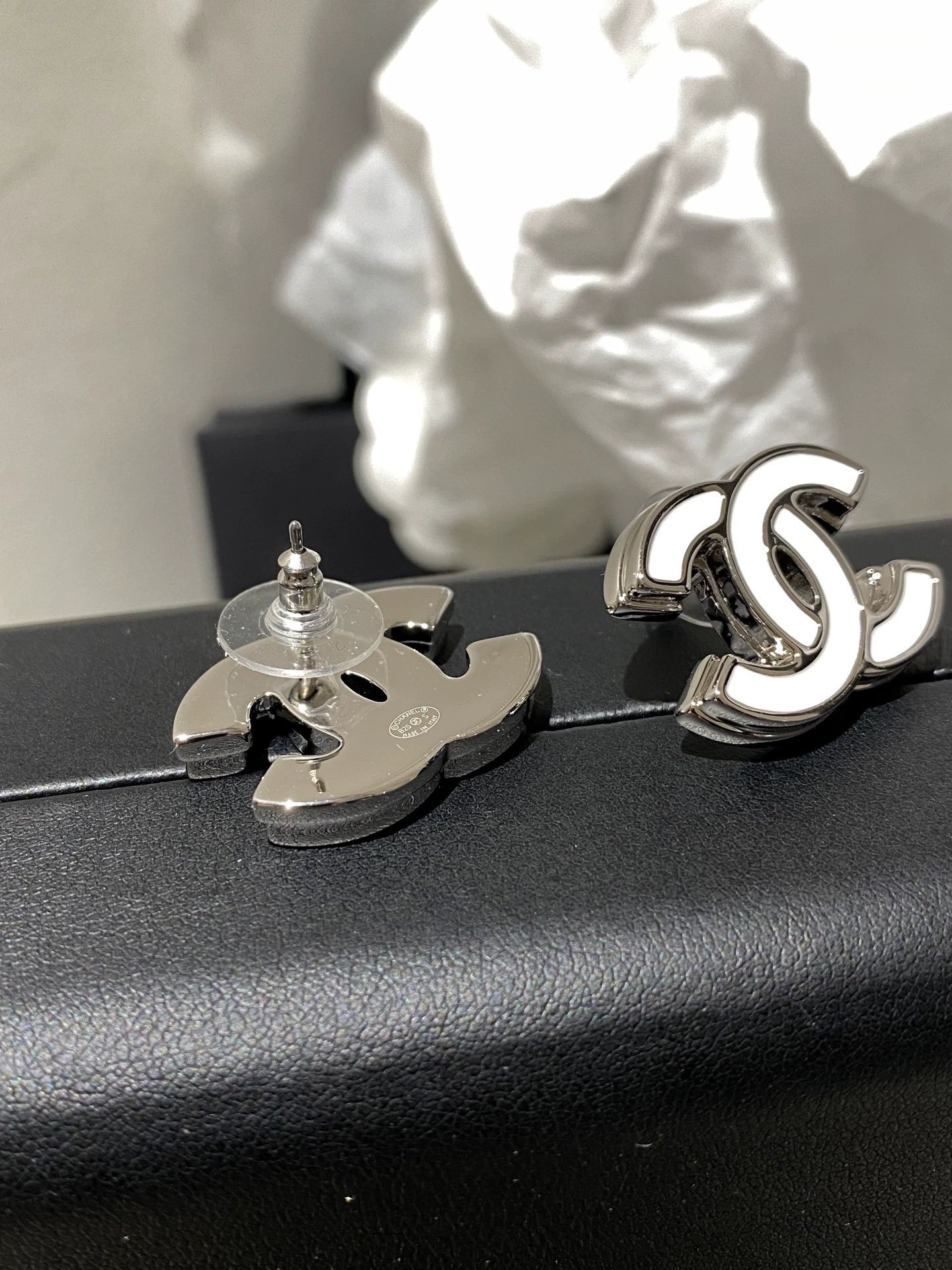 C 25 White enamel earrings