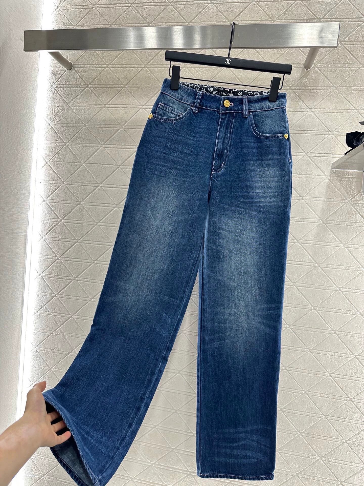 C 25 High-waisted bleached pleated denim trousers