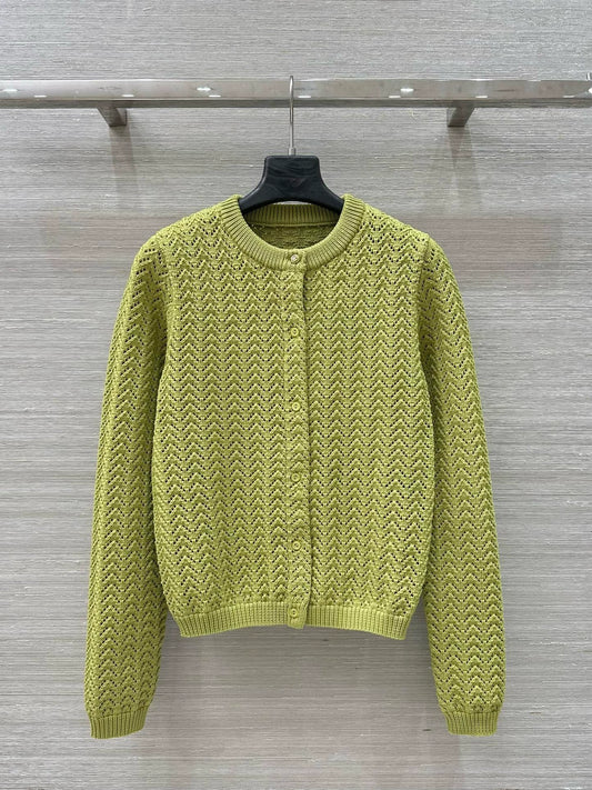 G 25 New Knitted cardigan with cut-out design.