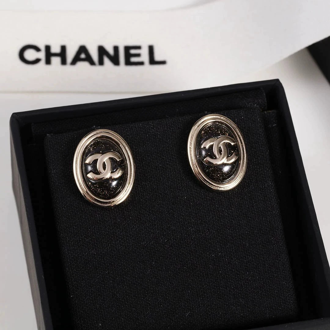 C 25 Gold Oval Black Double C Stud Earrings