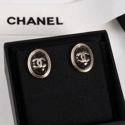 C 25 Gold Oval Black Double C Stud Earrings