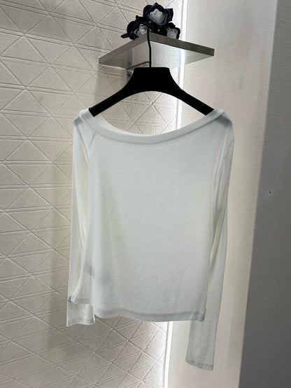 C 25 Slim-fitting, rhinestone-embellished, off-shoulder top.