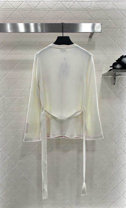 C New 25-item bag button and belted knitted cardigan.