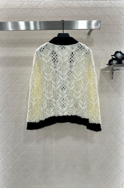 C 25 Contrast-color crochet cardigan.