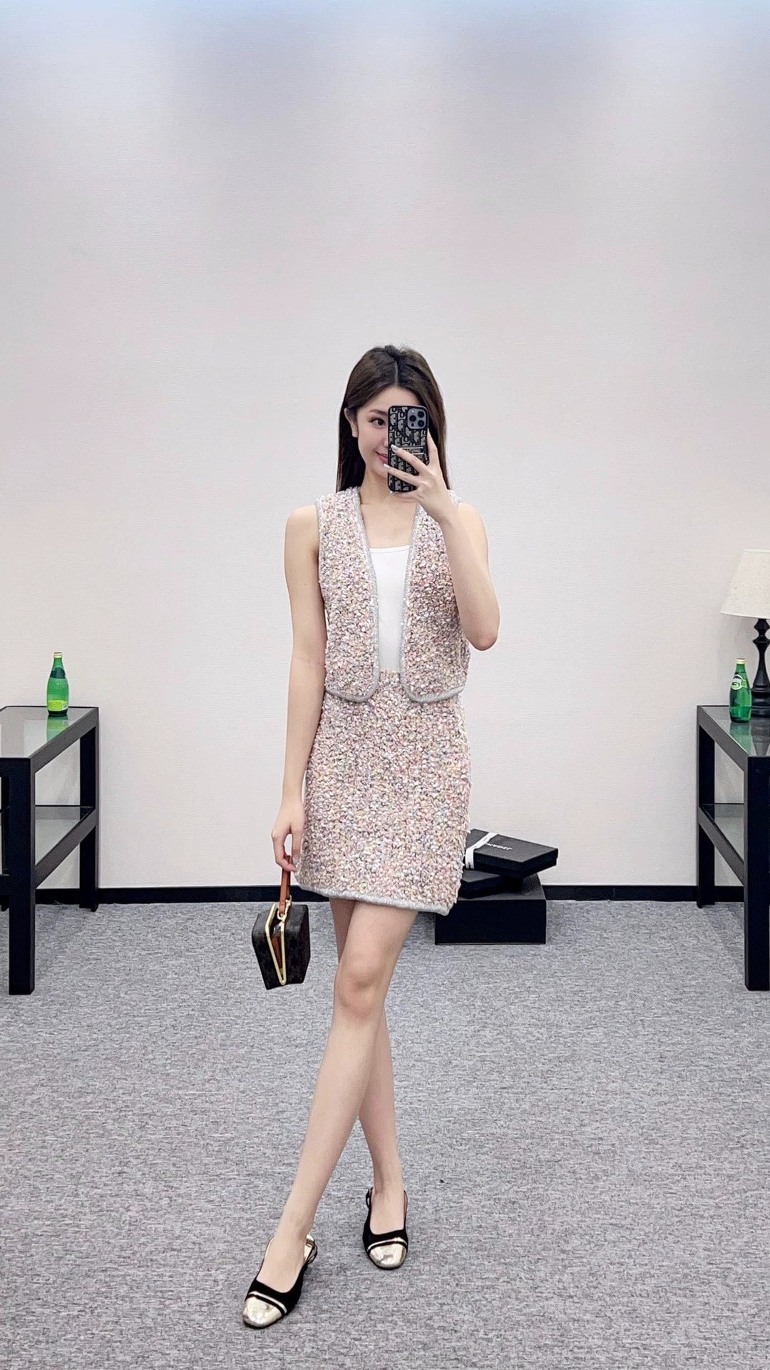 C 25 Knitted dress, vest, and skirt set.