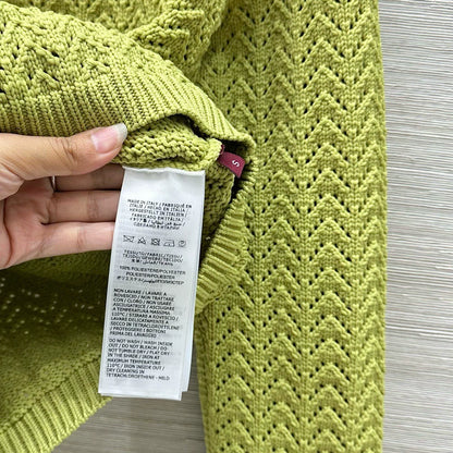 G 25 New Knitted cardigan with cut-out design.