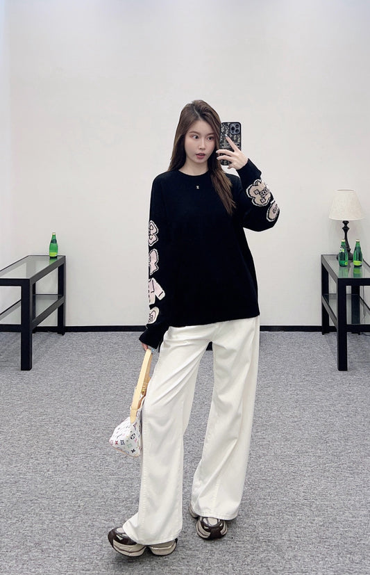 C 25 Comic-patterned crocheted letter knit sweater