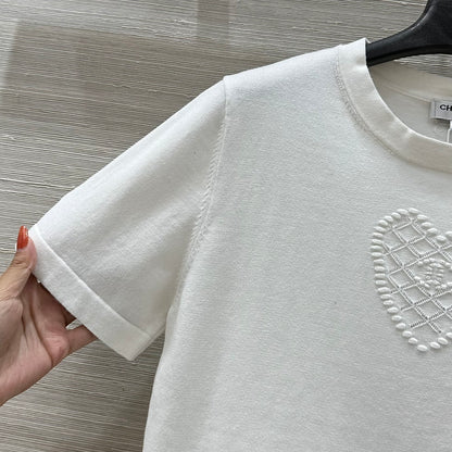 C 25 nouveaux produits, j'adore le haut à manches courtes en tricot double C 