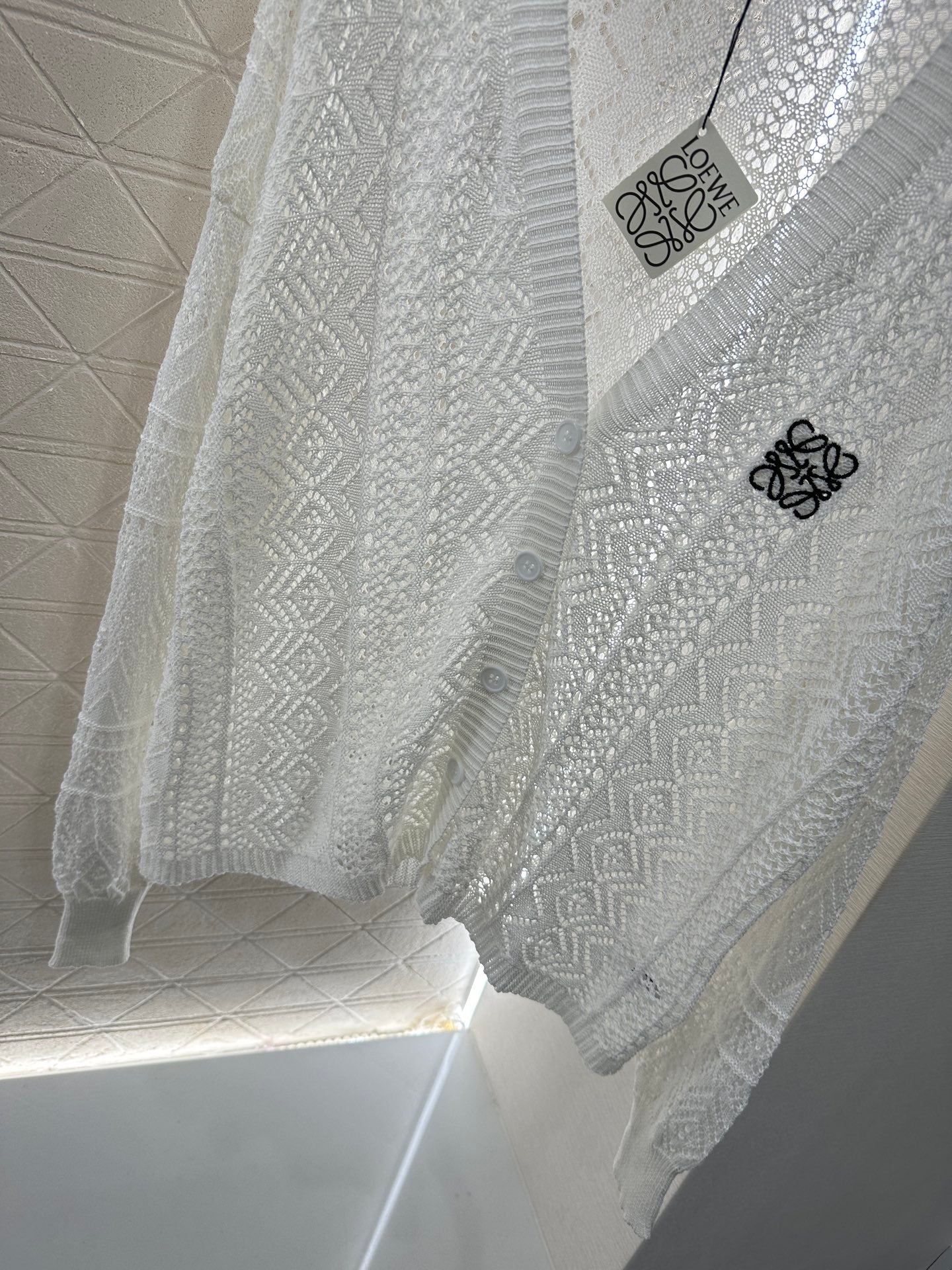 Lo 2025 new product Hollow cardigan and skirt set