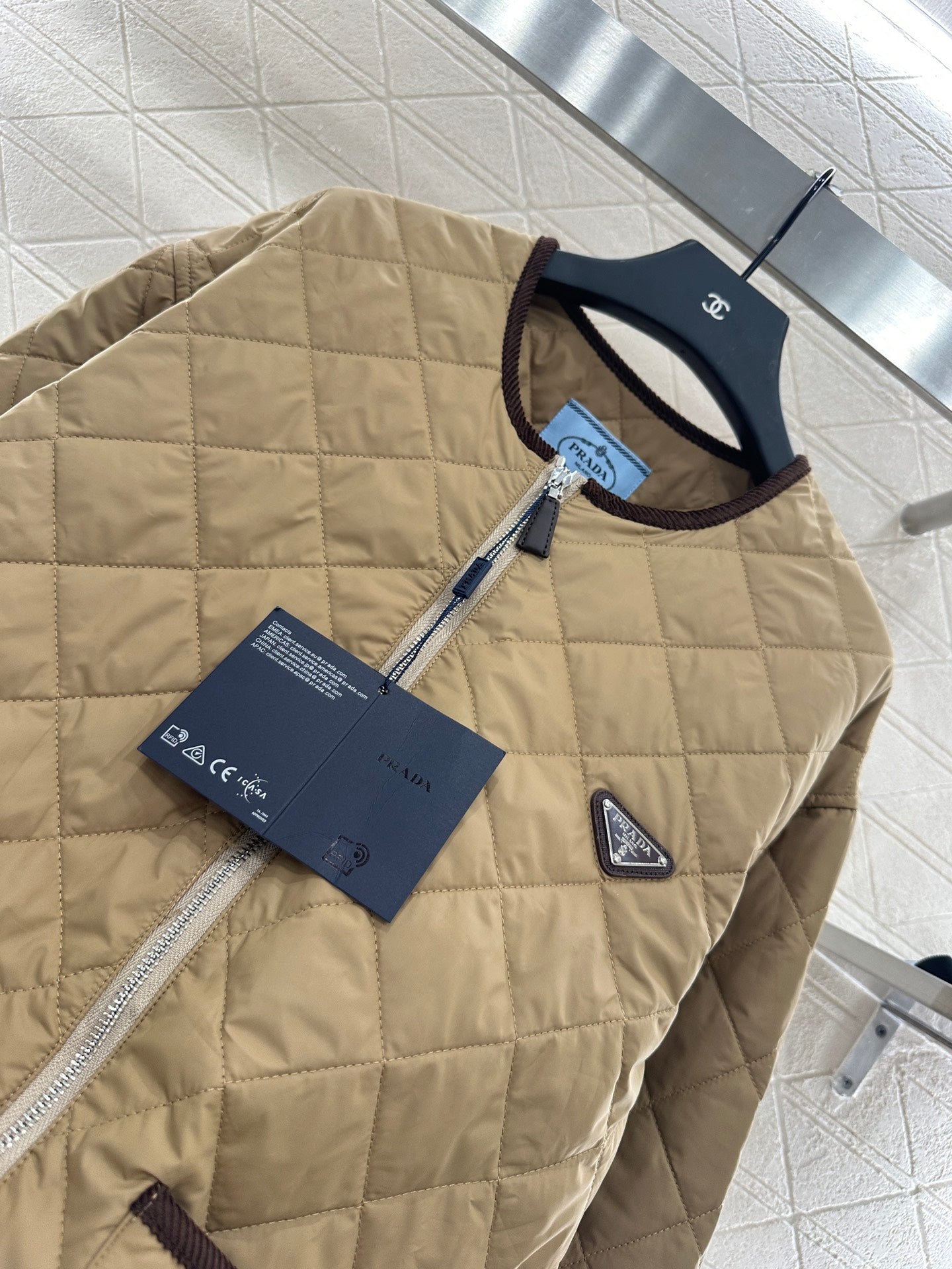 P 25 Diamond-patterned crew-neck down jacket.