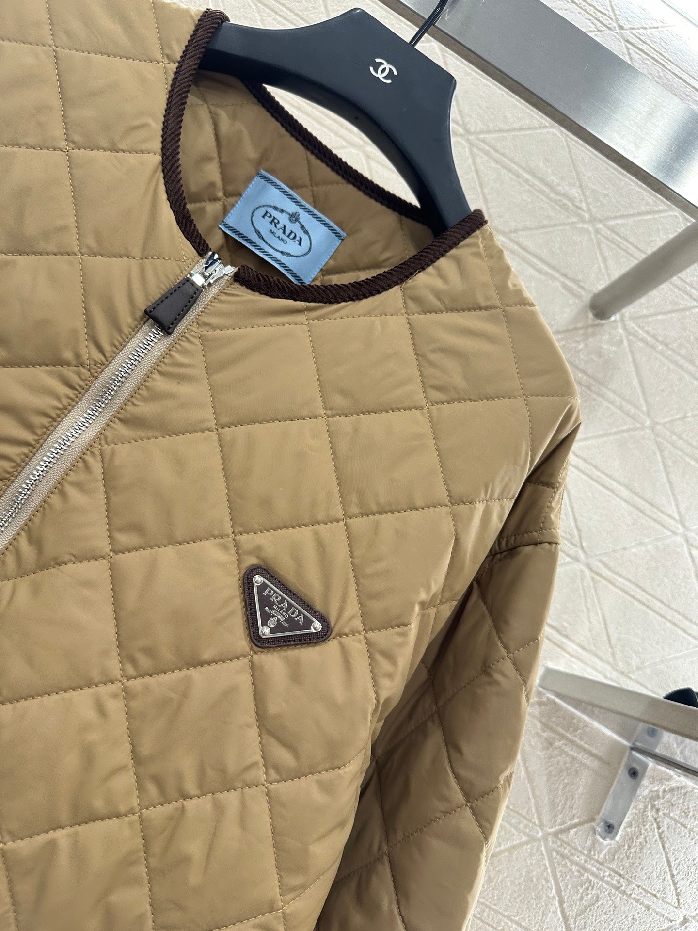 P 25 Diamond-patterned crew-neck down jacket.