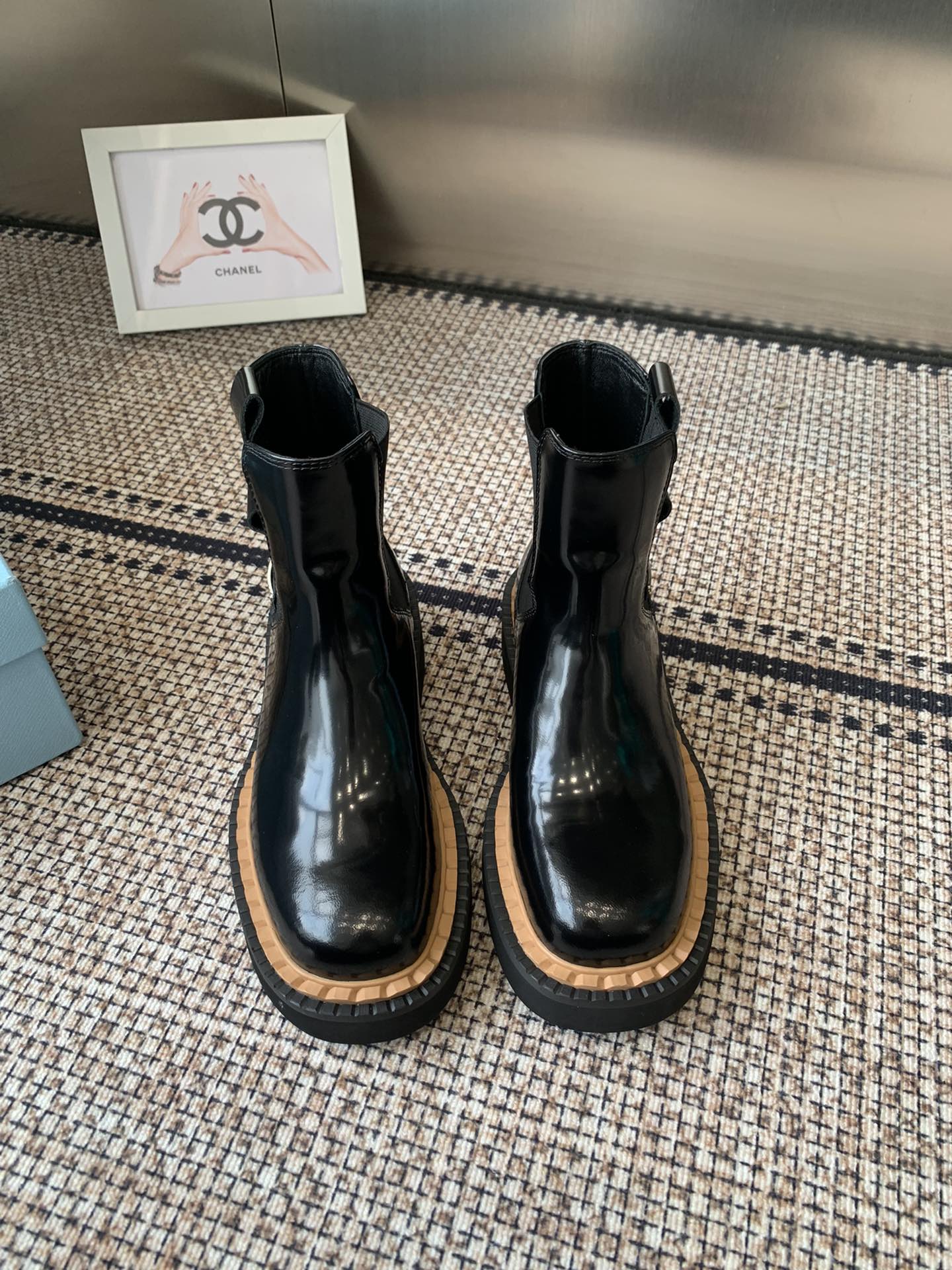 Pra 25fw Classic triangle ankle boots in shiny black