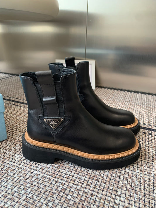 Pra 25fw Classic matte black triangle ankle boots