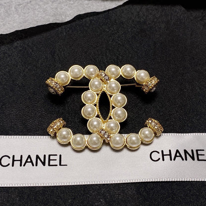C 25 Pearl logo brooch