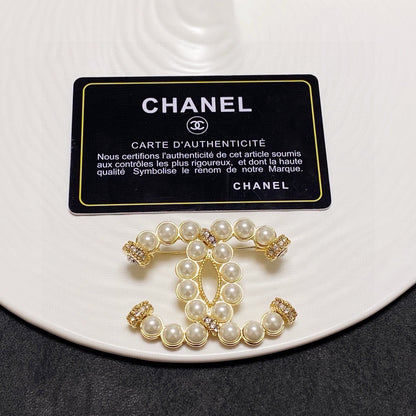 C 25 Pearl logo brooch