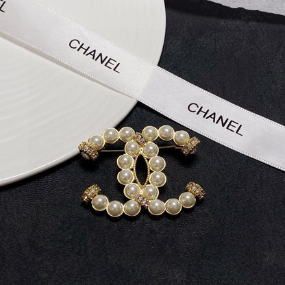 C 25 Pearl logo brooch