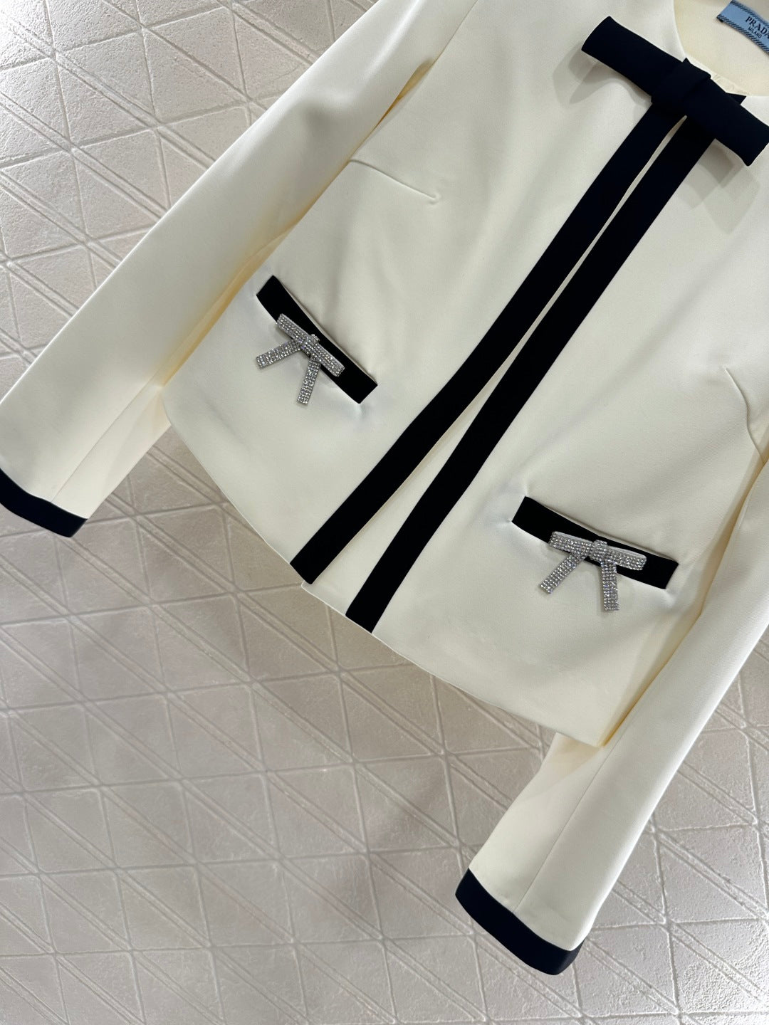 Pr 25 Round neck bow jacket