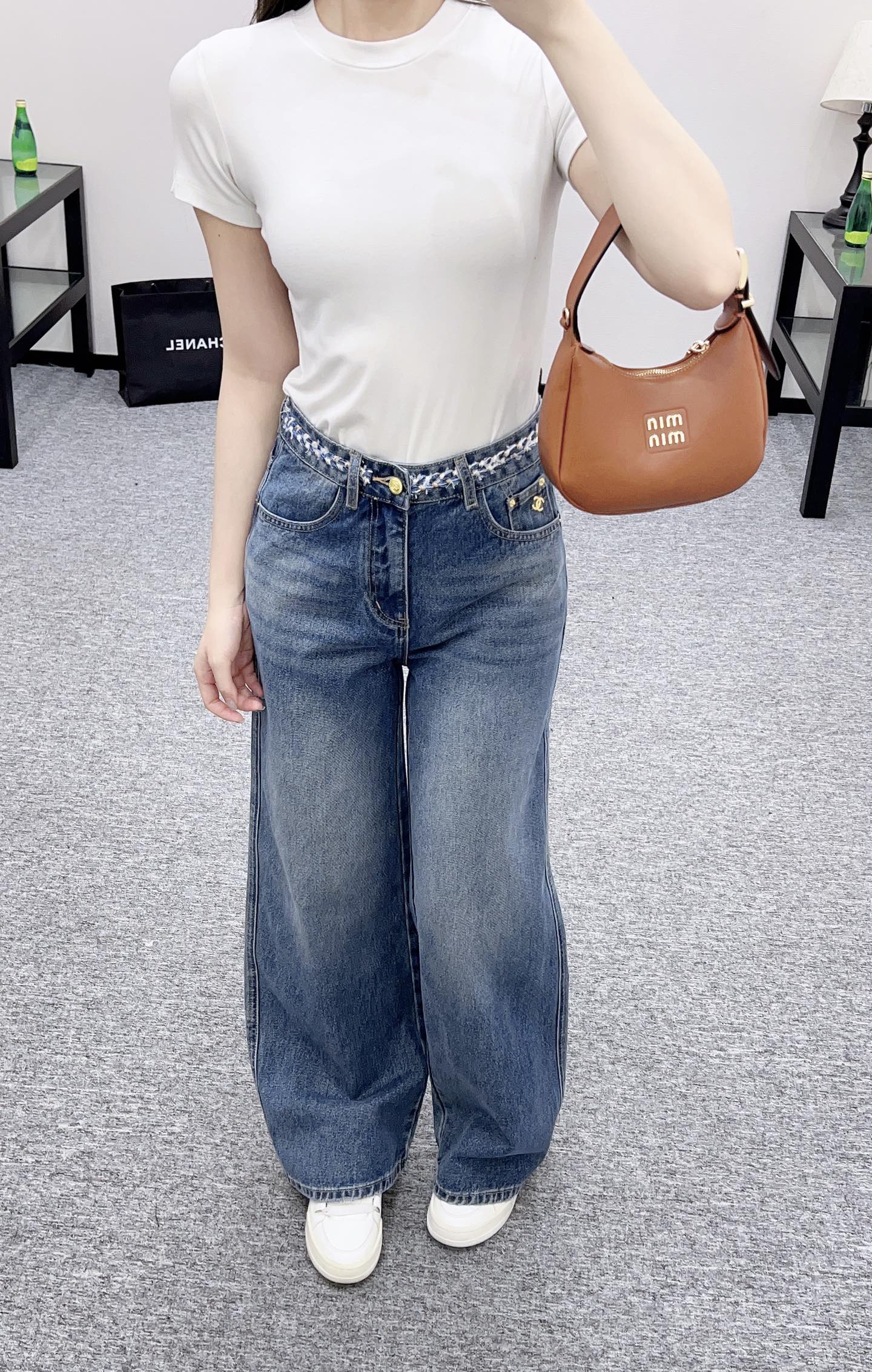 C 25 High-waisted bleached pleated denim trousers