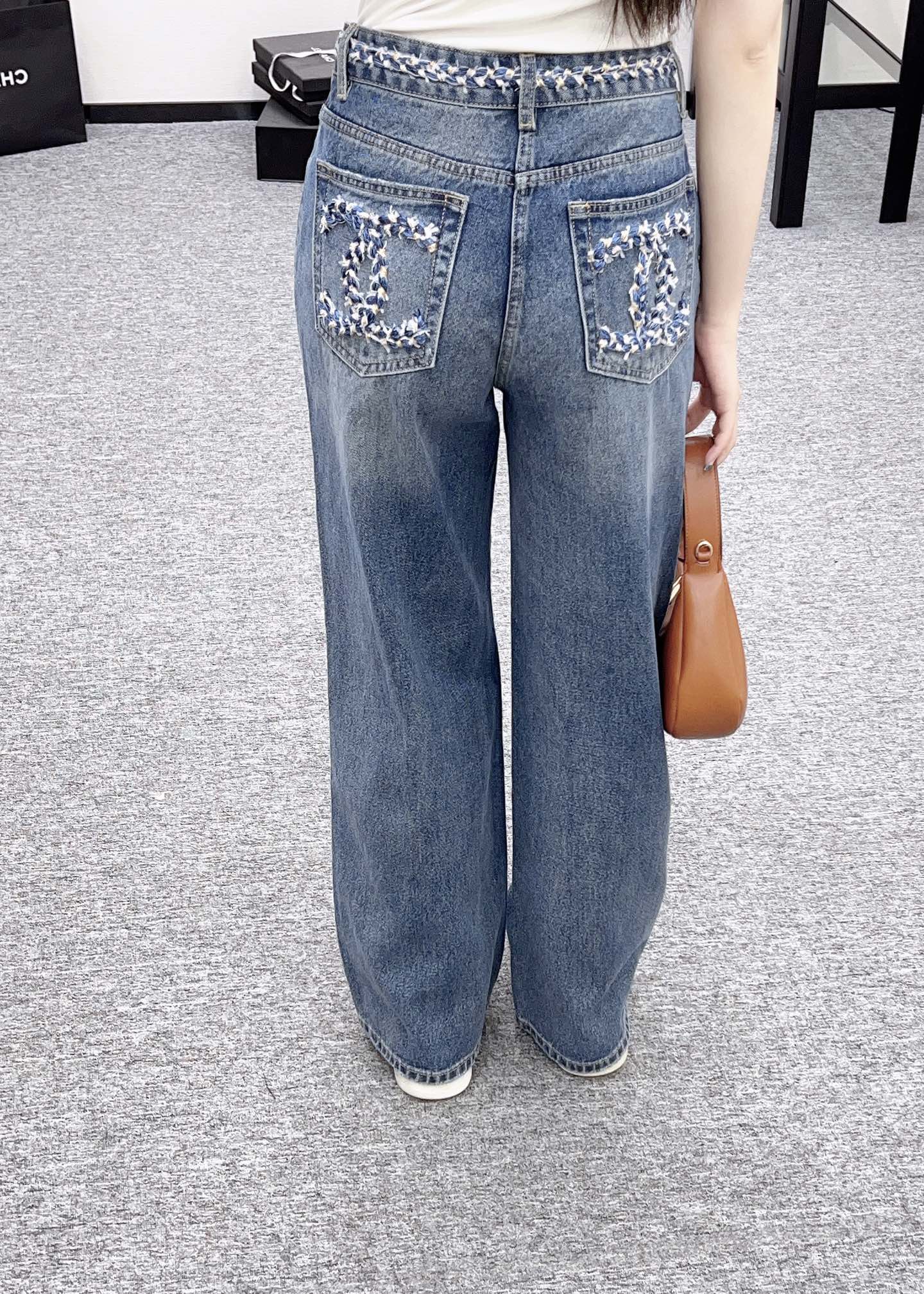 C 25 High-waisted bleached pleated denim trousers
